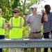 Supporters hold hands as they rally to promote awareness and raise funds for the Camp Take Notice during a rally along Wagner Road on Thursday.  Melanie Maxwell I AnnArbor.com